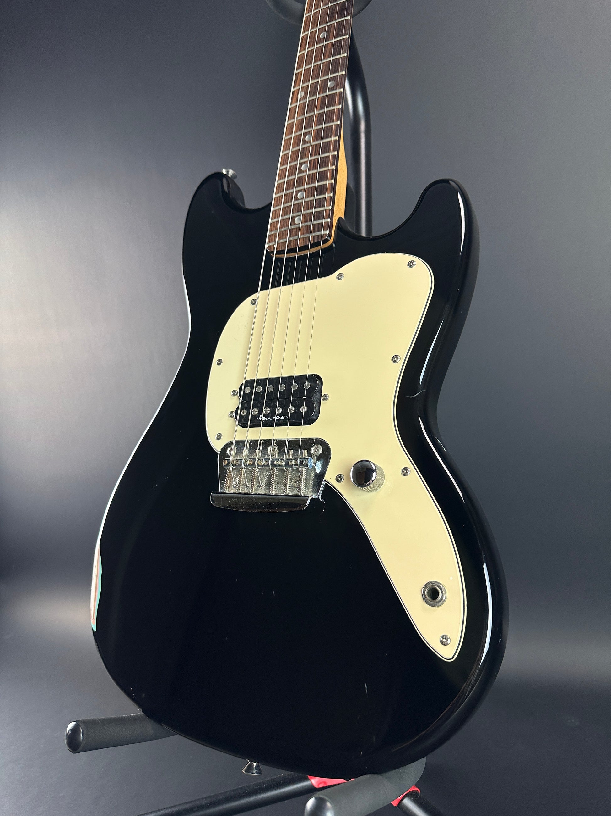 Front angle of Used 1999 Squier Vista Musicmaster Black.