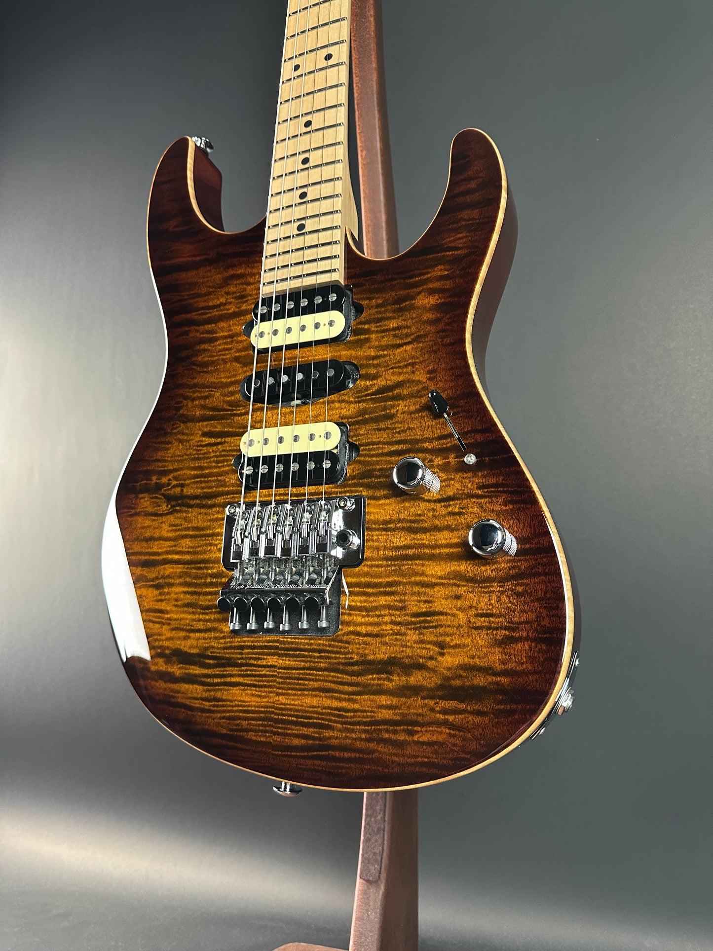 Front angle of Used 2015 Suhr Modern Pro Flame Top HSH Floyd Rose.