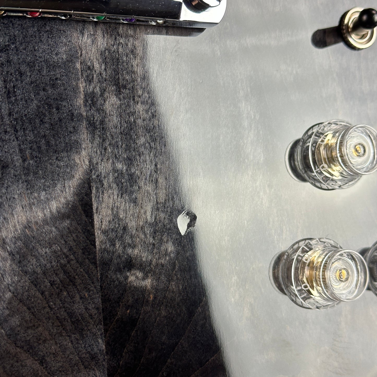 Ding near controls of Used Gibson SG Modern Trans Ebony Fade.