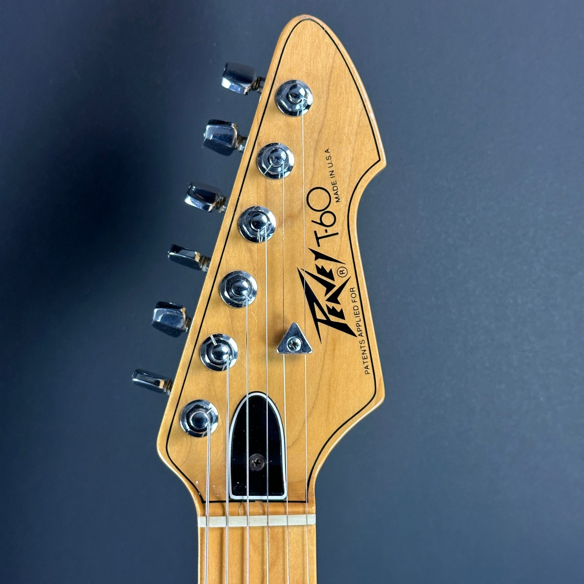 Front of headstock of Used 1978 Peavey T-60 Natural.