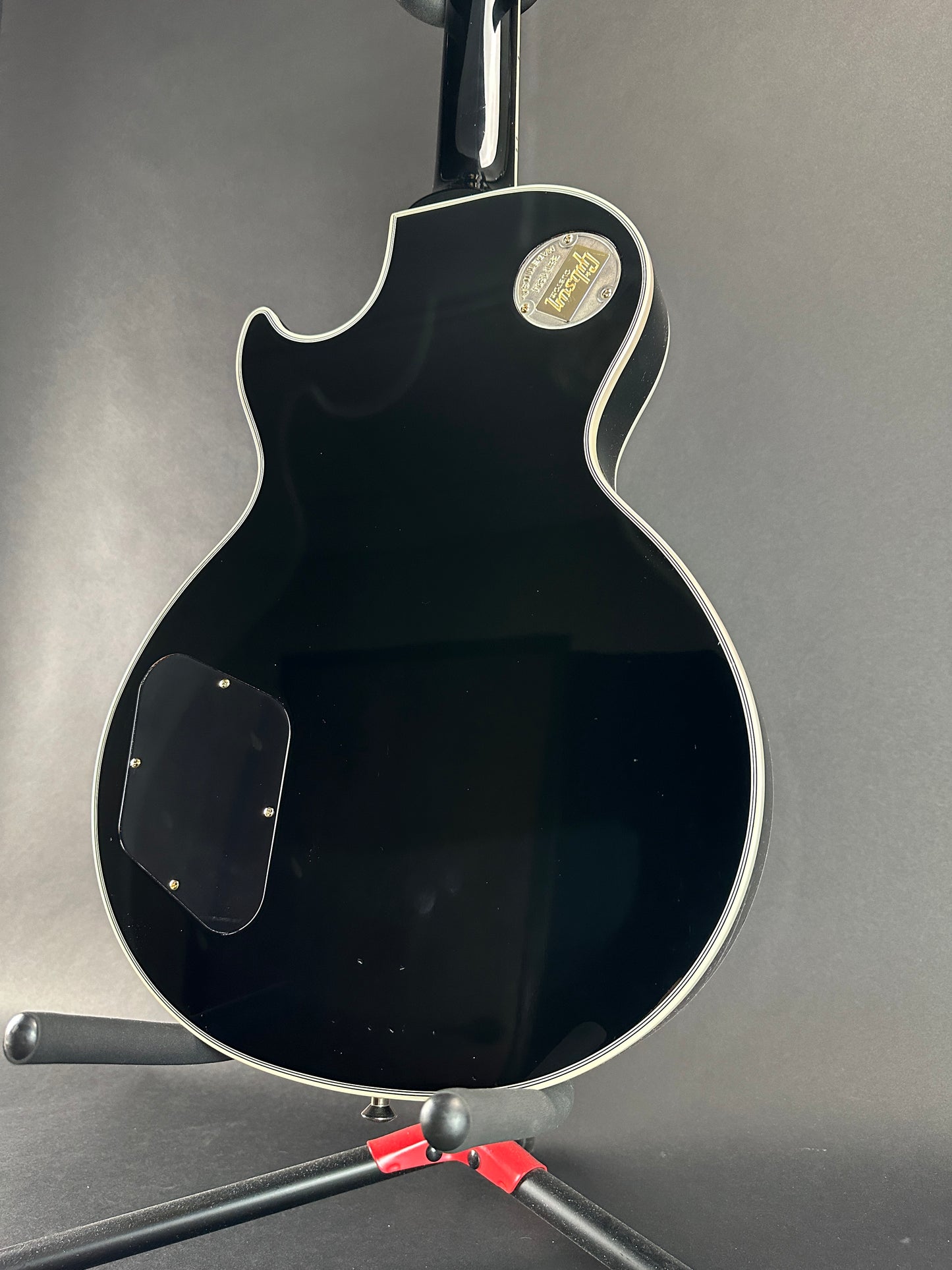 Back angle of Used Gibson Les Paul Custom Ebony.