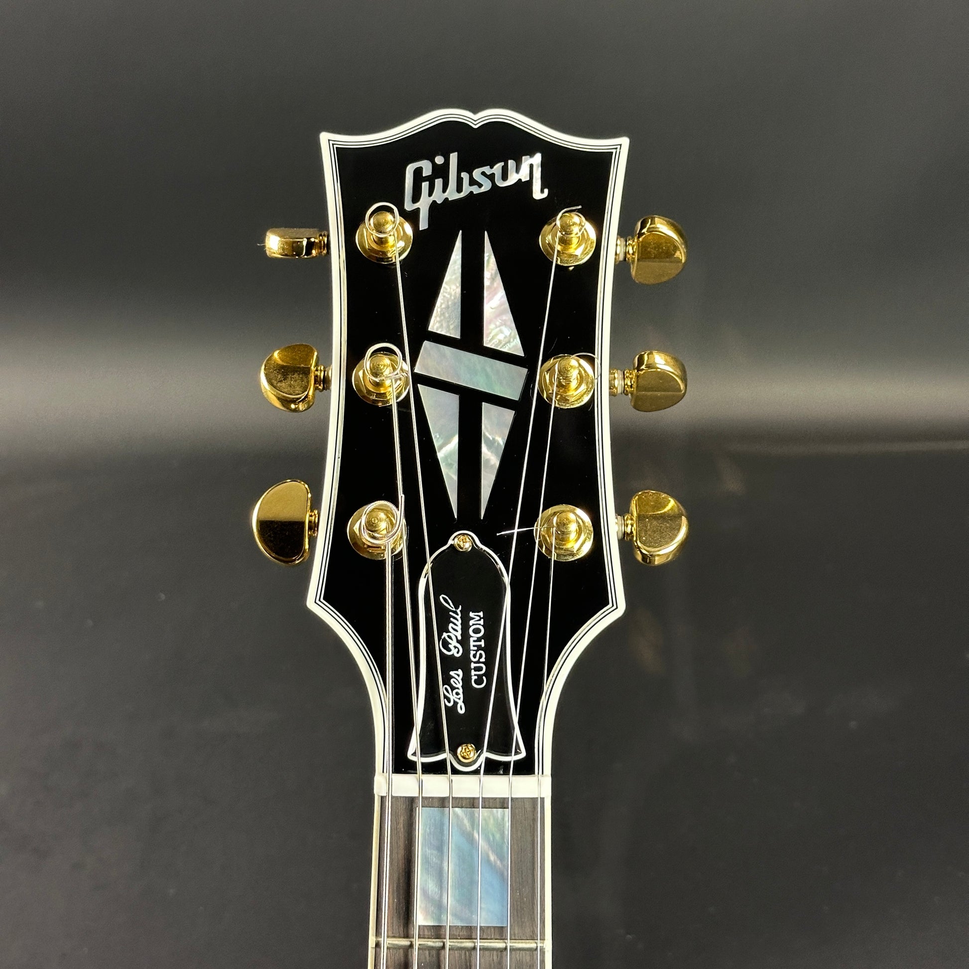 Front of headstock of Used Gibson Custom Shop Les Paul Custom Ebony.