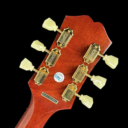 Back of headstock of Used Epiphone Hummingbird Cherry Burst AE.