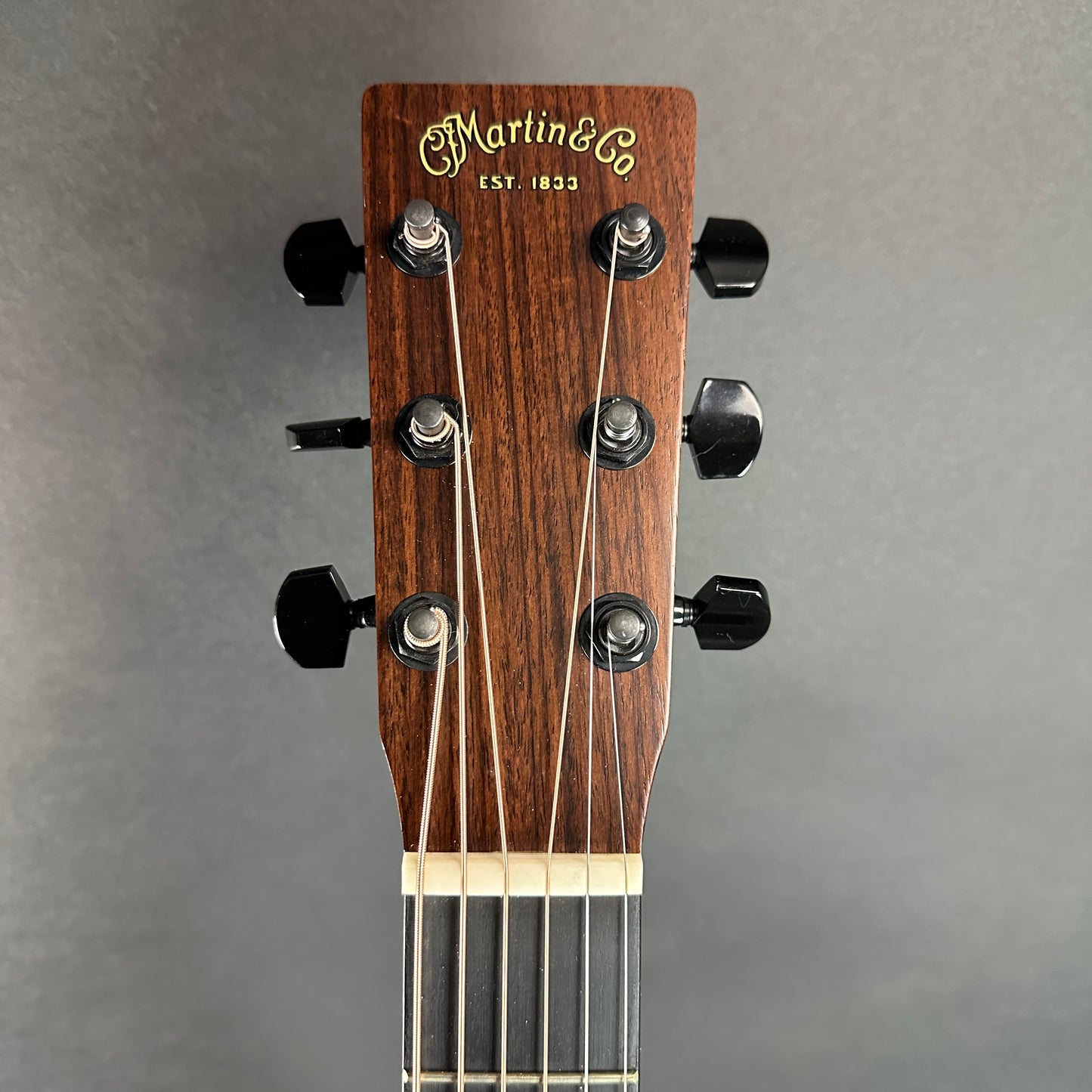 Front of headstock of Used Martin GPC16E Sunburst.