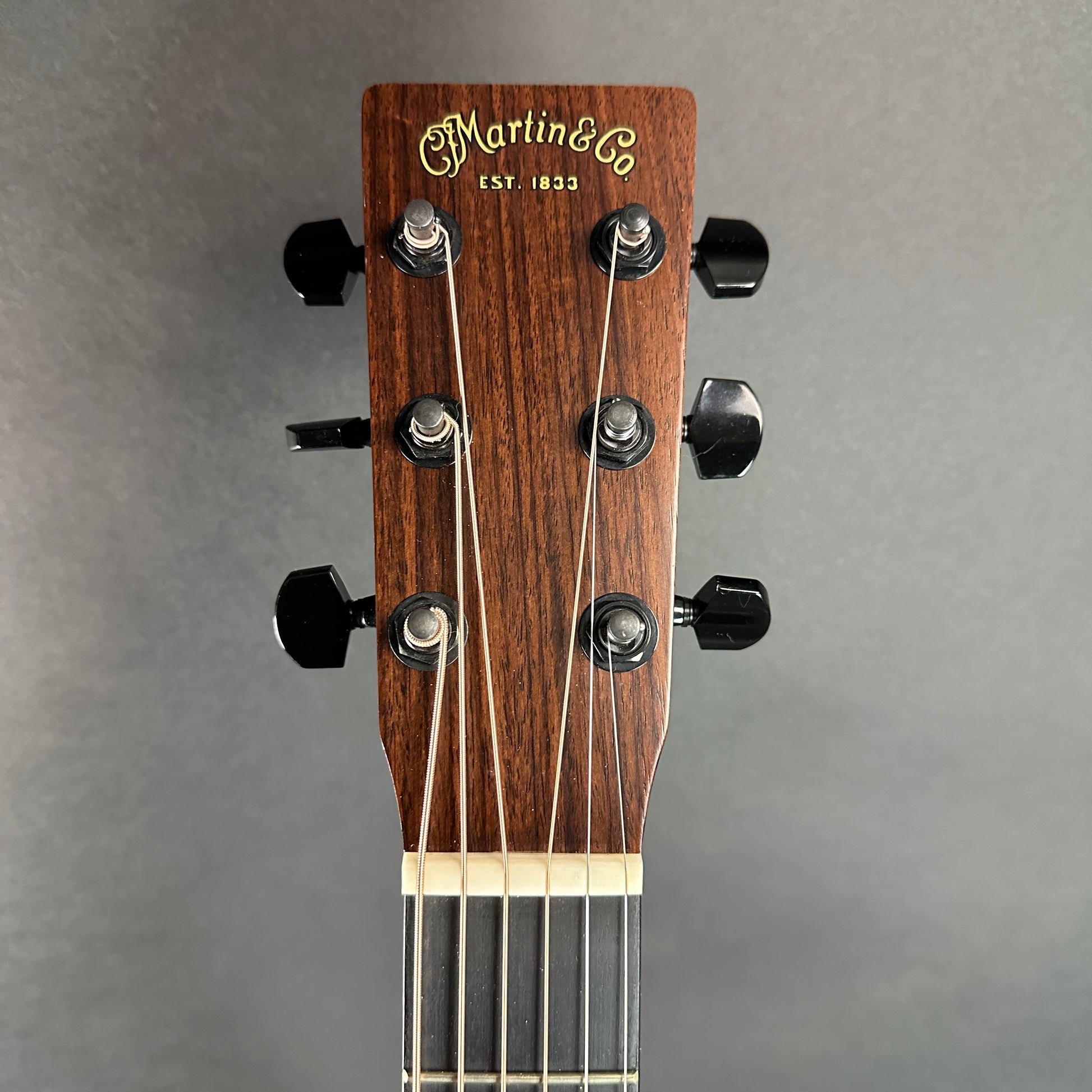 Front of headstock of Used Martin GPC16E Sunburst.