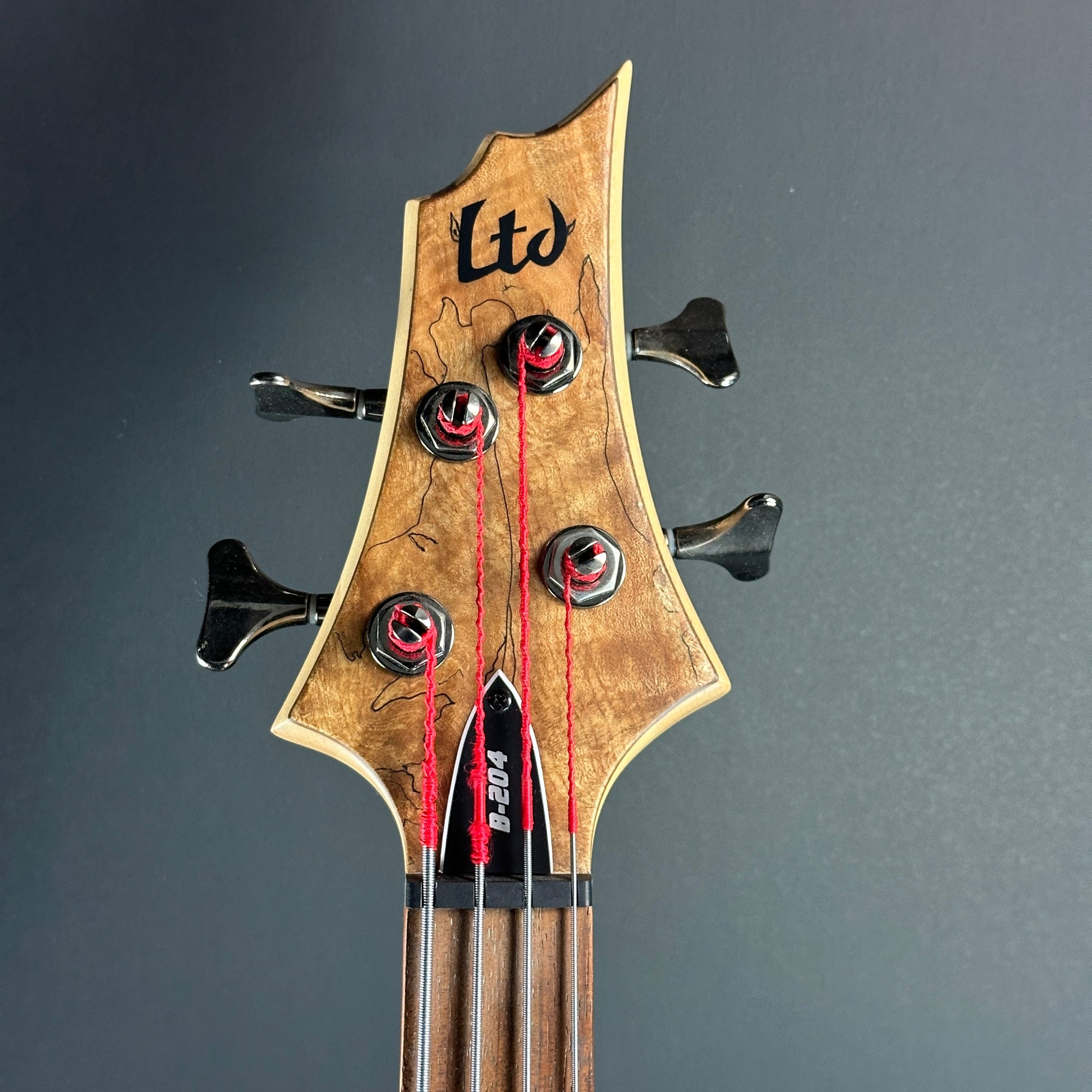 Front of headstock of Used ESP LTD B-204SM Bass.