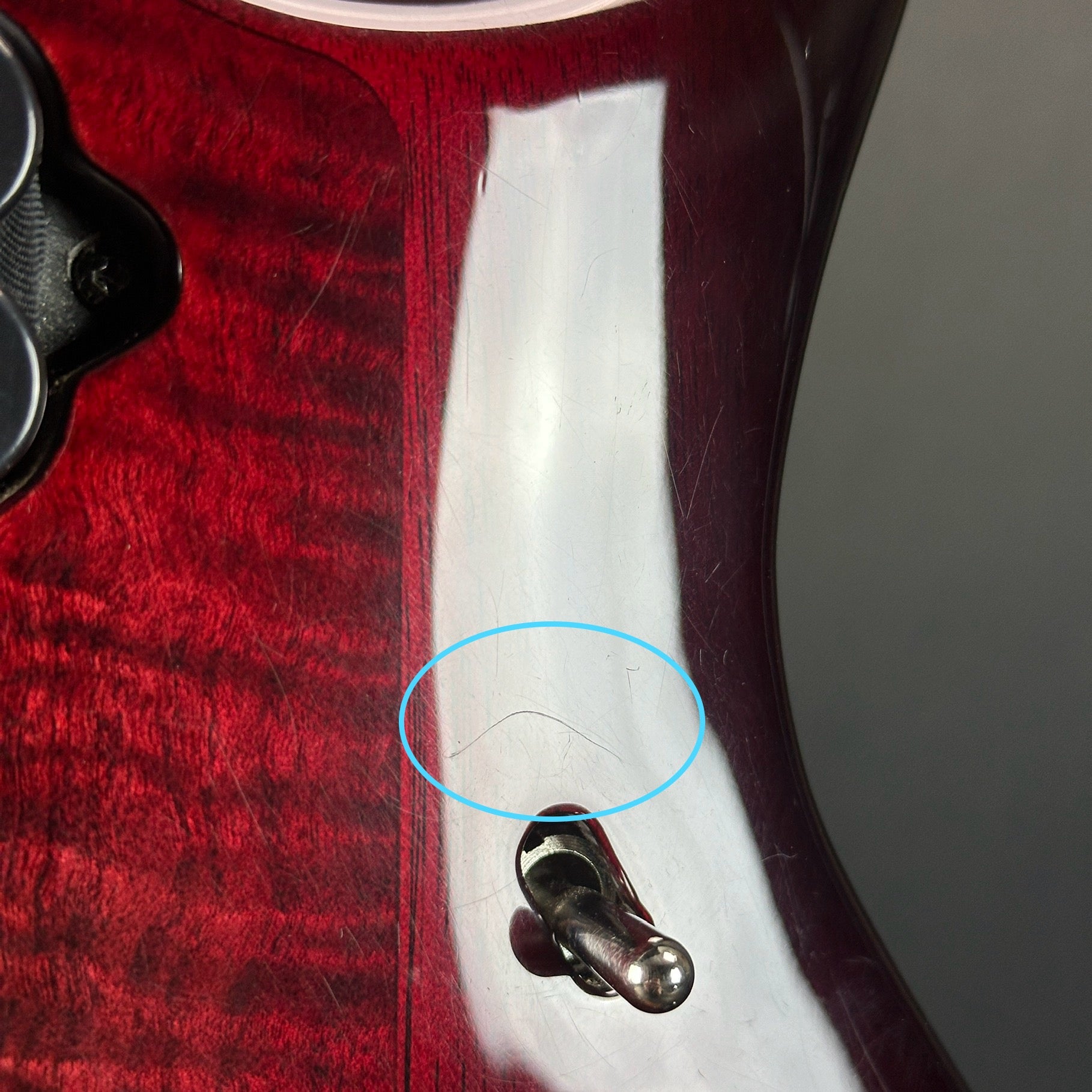 Scratches on body of Used Ernie Ball Petrucci Monarch Majesty Red.