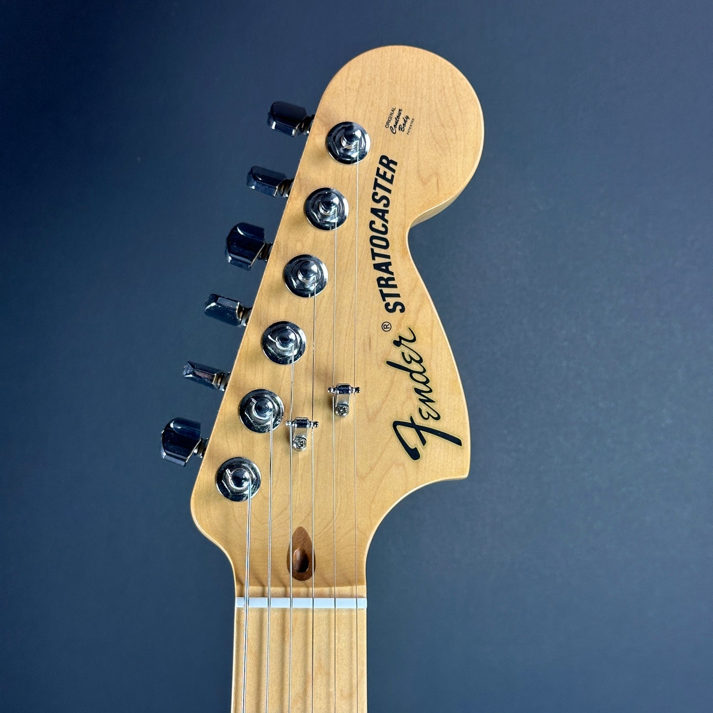 Front of headstock of Used Fender American Special Strat Burst.