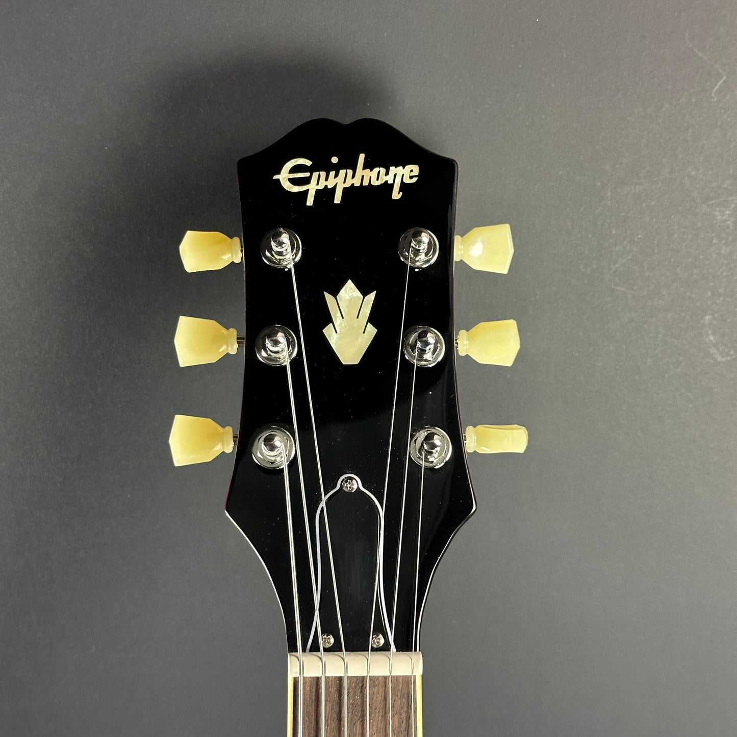 Front of headstock of Used Epiphone ES-335 Figured Blueberry Burst.