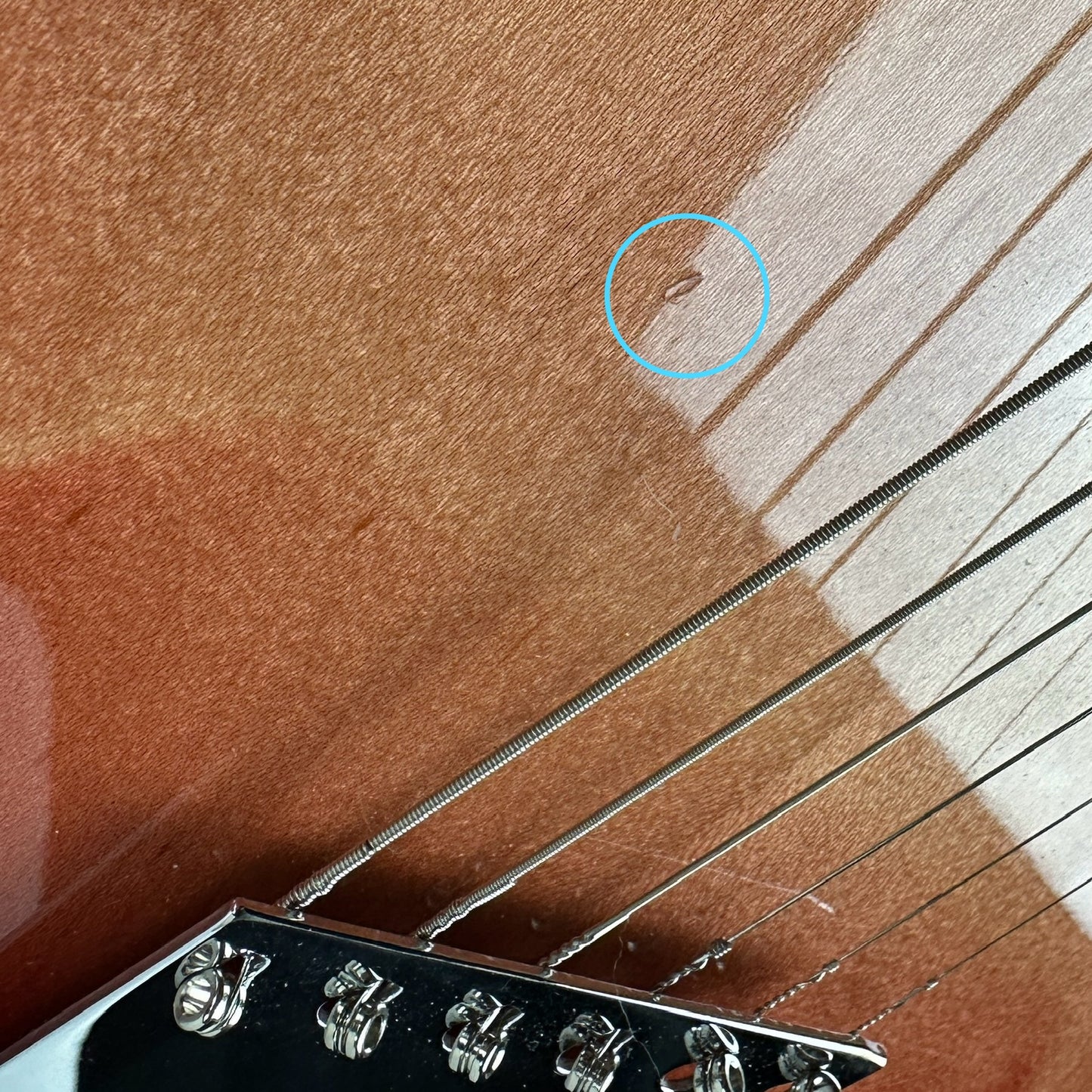 Ding near bridge of Used 1997 Rickenbacker 360V64 Fireglow.