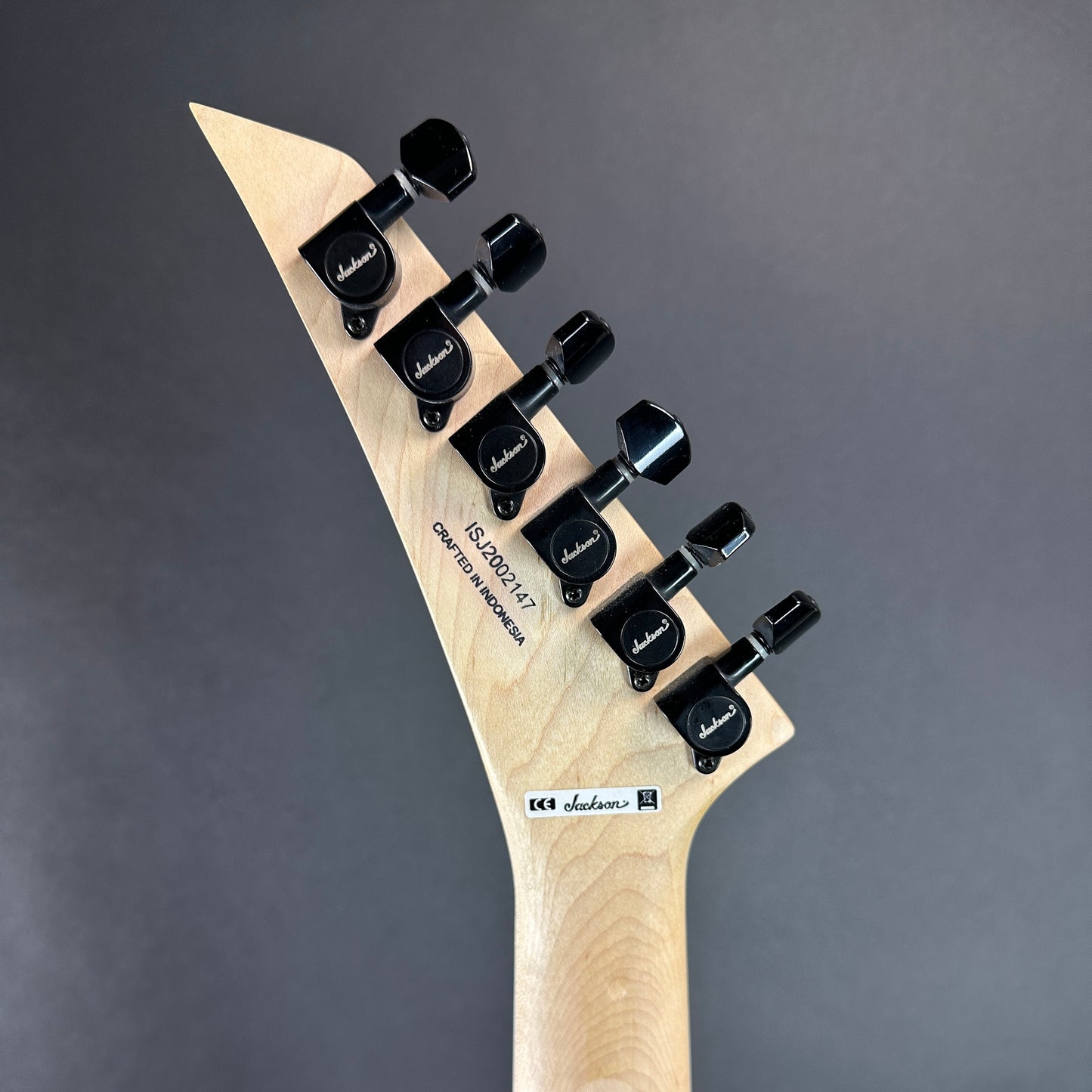 Back of headstock of Used Jackson Pro Series SL2M Magenta.