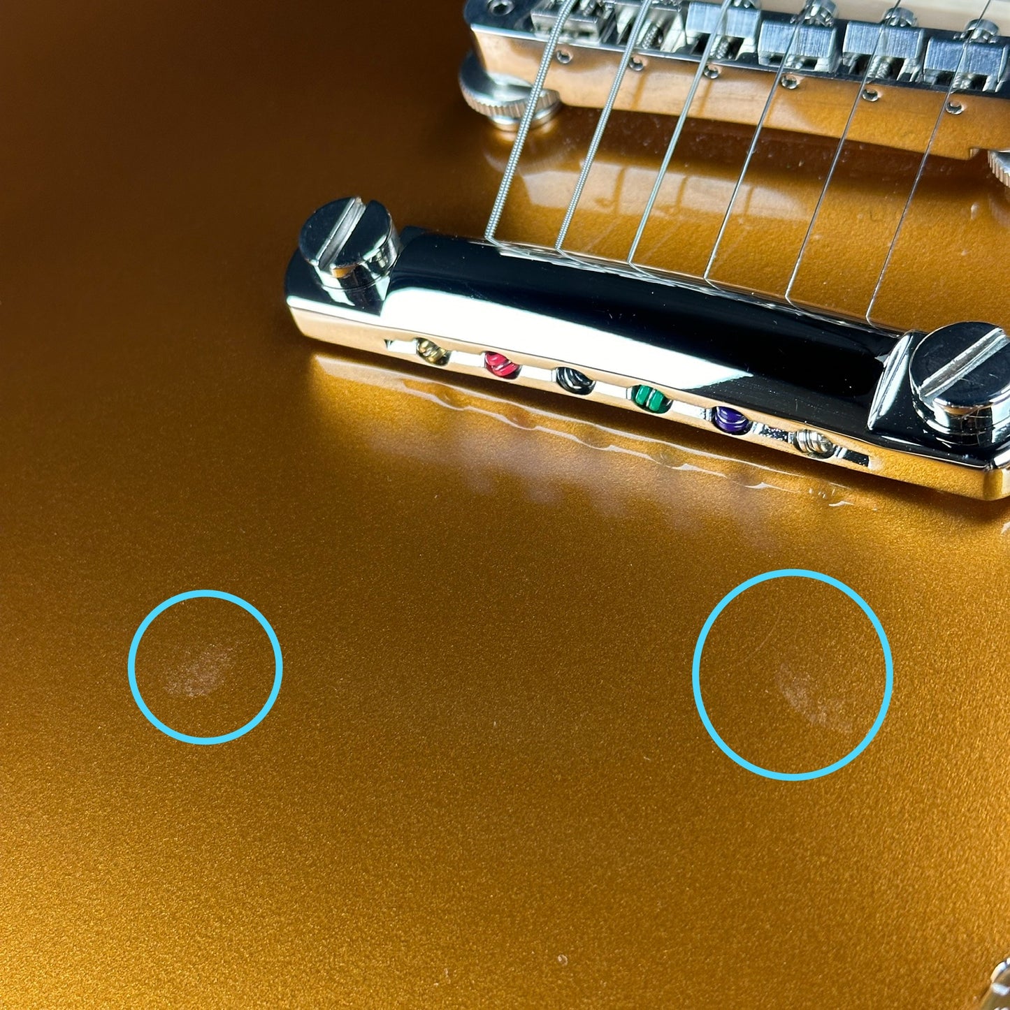 Two blemishes near bridge of Used 2020 Gibson Les Paul Standard 50's Goldtop.