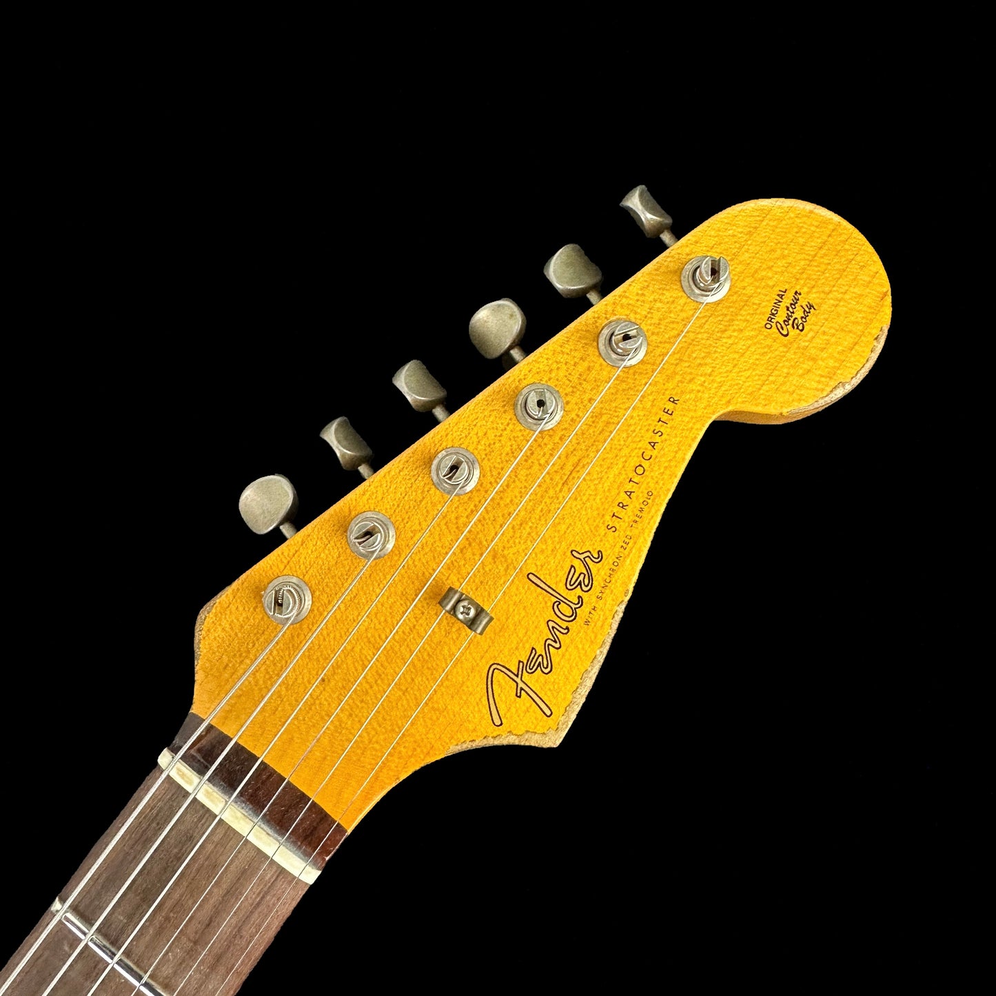 Closeup of Fender Custom Shop 1961 Strat Heavy Relic Super Faded Aged Sonic Blue/3-Color Sunburst headstock.