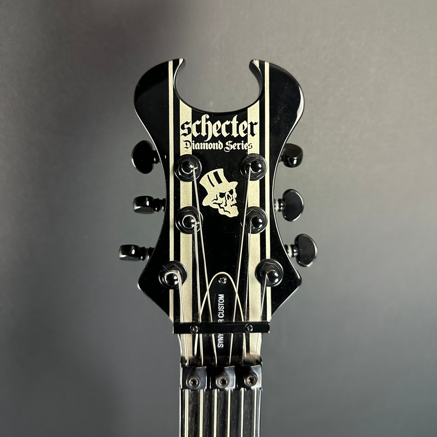 Front of headstock of Used Schecter Synyster Gates.