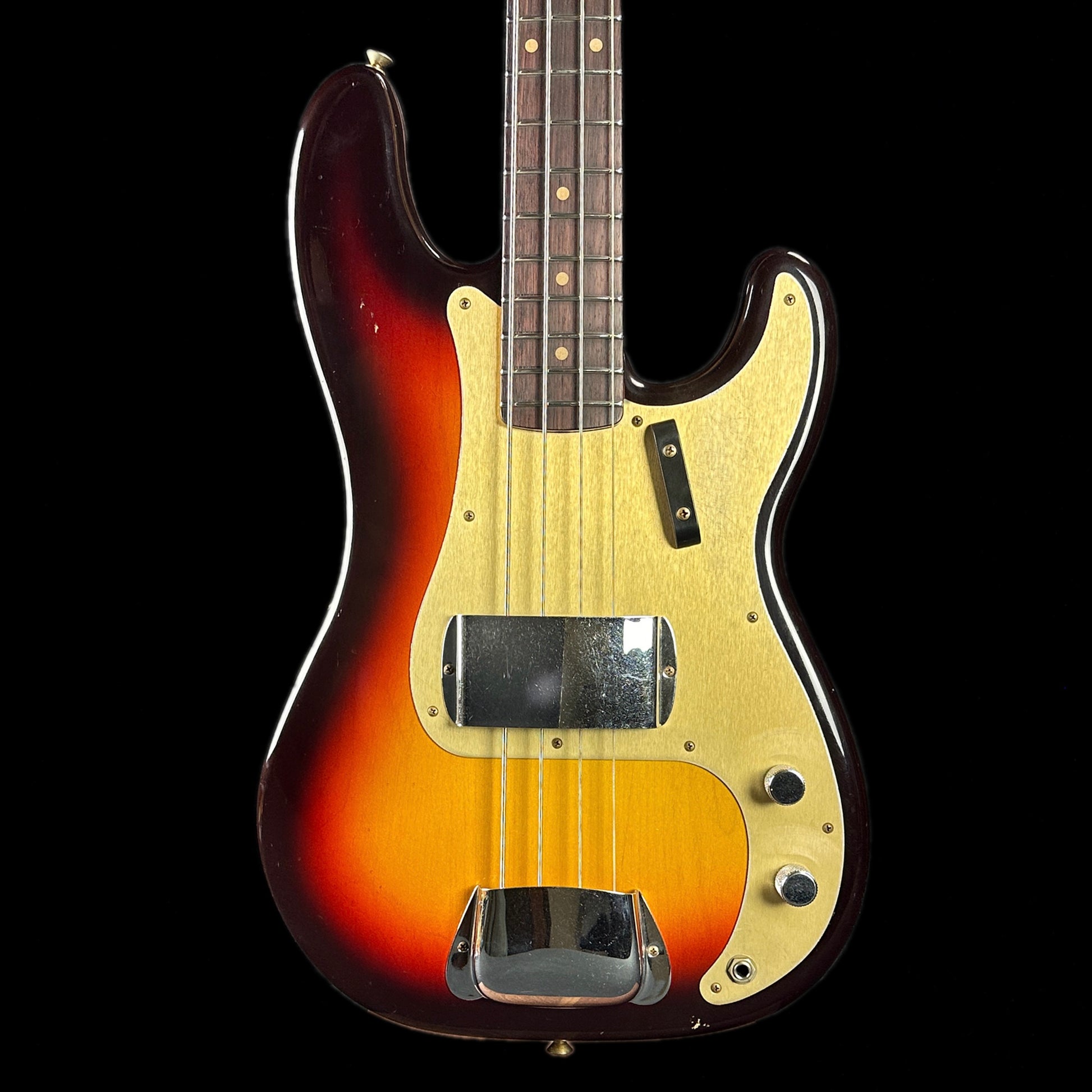 Front of body of Fender Custom Shop Limited Edition '59 Precision Bass Journeyman Relic Chocolate 3 Color Sunburst.