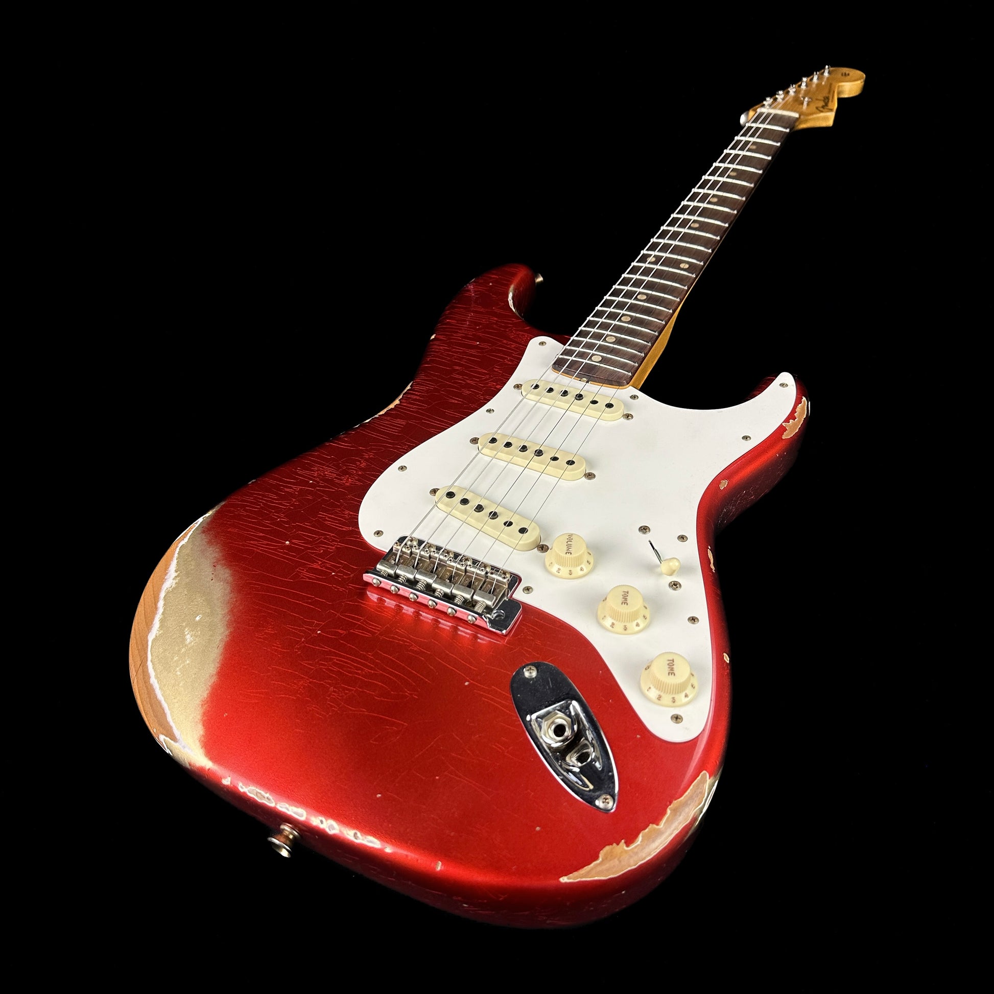 Front angle of Fender Custom Shop 59 Strat Heavy Relic Super Faded Aged Candy Apple Red.