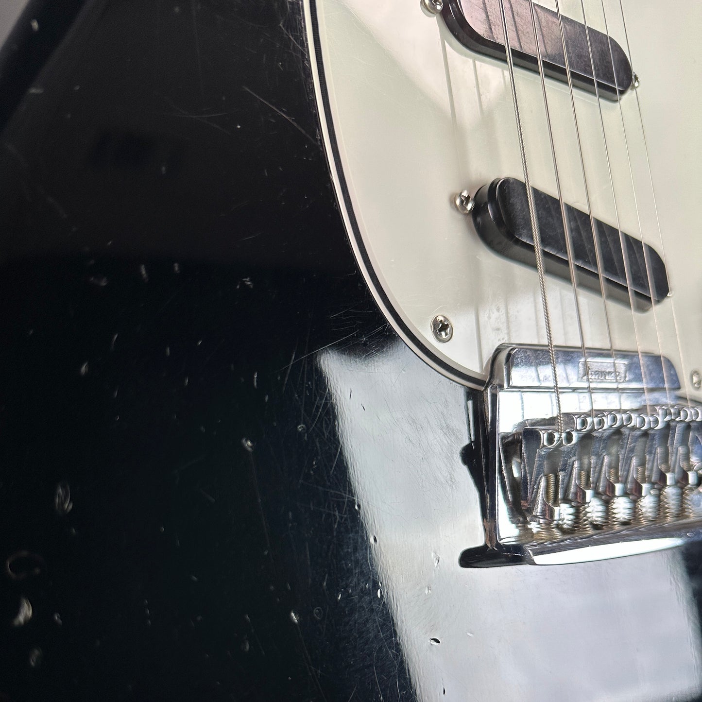 Damage near bridge of Used 1984 Ibanez Roadstar II RS-135.