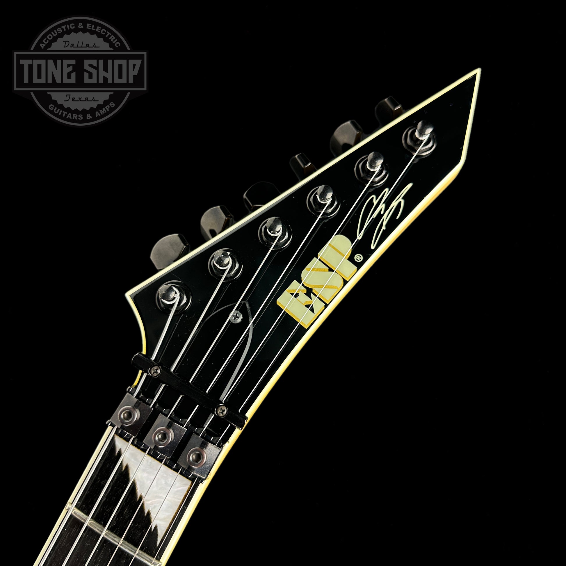 Front of headstock of Used ESP Alexi Laiho Signature Black with Yellow.