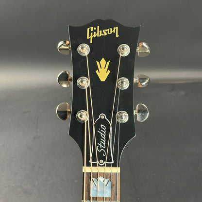 Front of headstock of Used Gibson SJ-200 Studio Rosewood Burst.