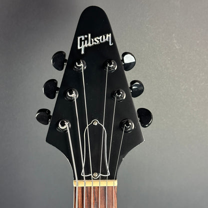 Front of headstock of Used Gibson flying V B2 Black.