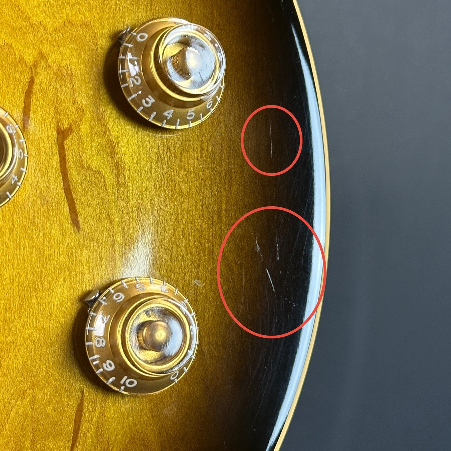 Scratches on front of Used 2006 Gibson Les Paul Classic.