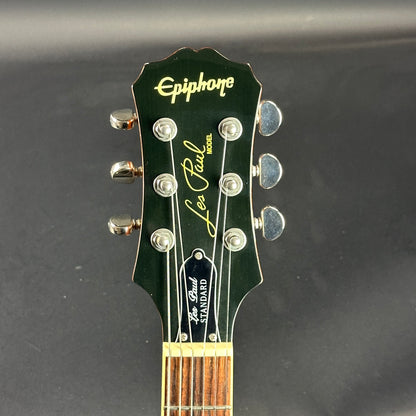 Front of headstock of Used Epiphone Les Paul Standard Honeyburst.