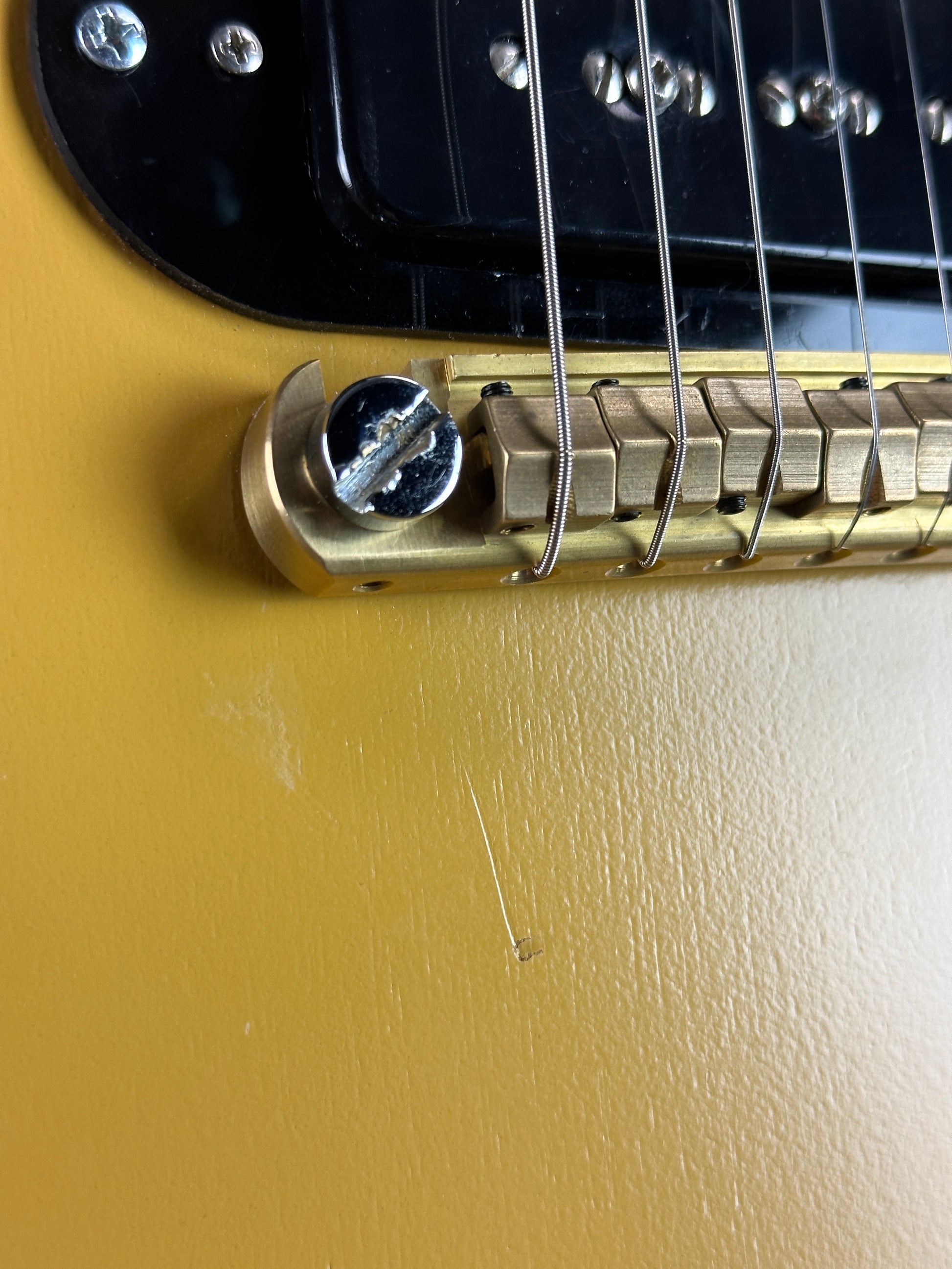 Mark under bridge of Used Gibson USA Les Paul Melody Maker.