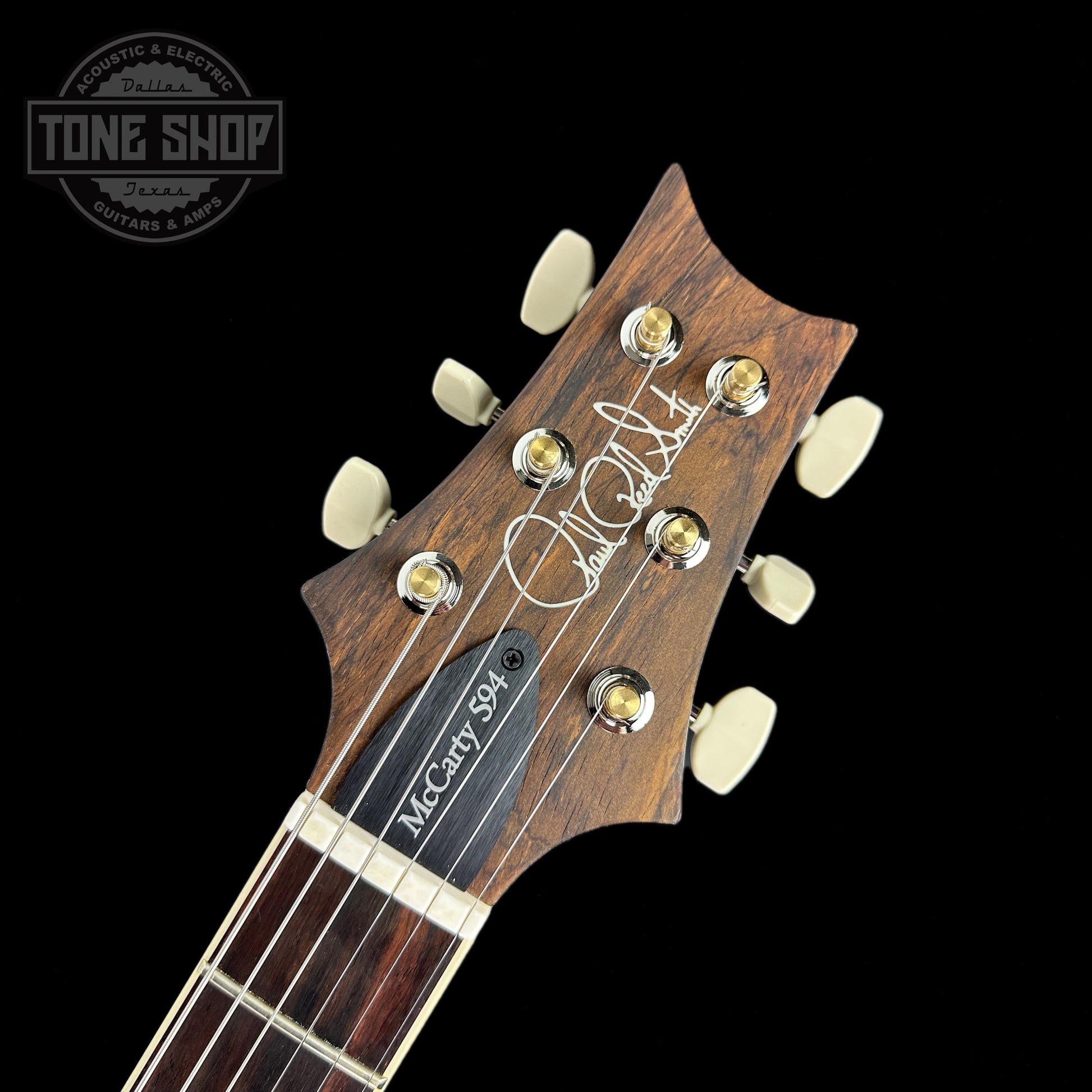 Front of headstock of PRS Wood Library McCarty 594 10-top Quilt Faded Whale Blue Smokeburst.