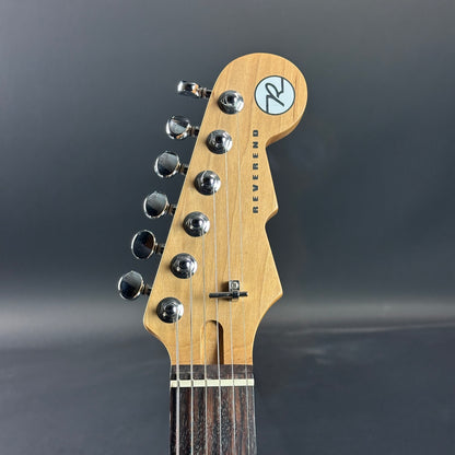 Front of headstock of Used Reverend Double Agent OG Periwinkle Burst.