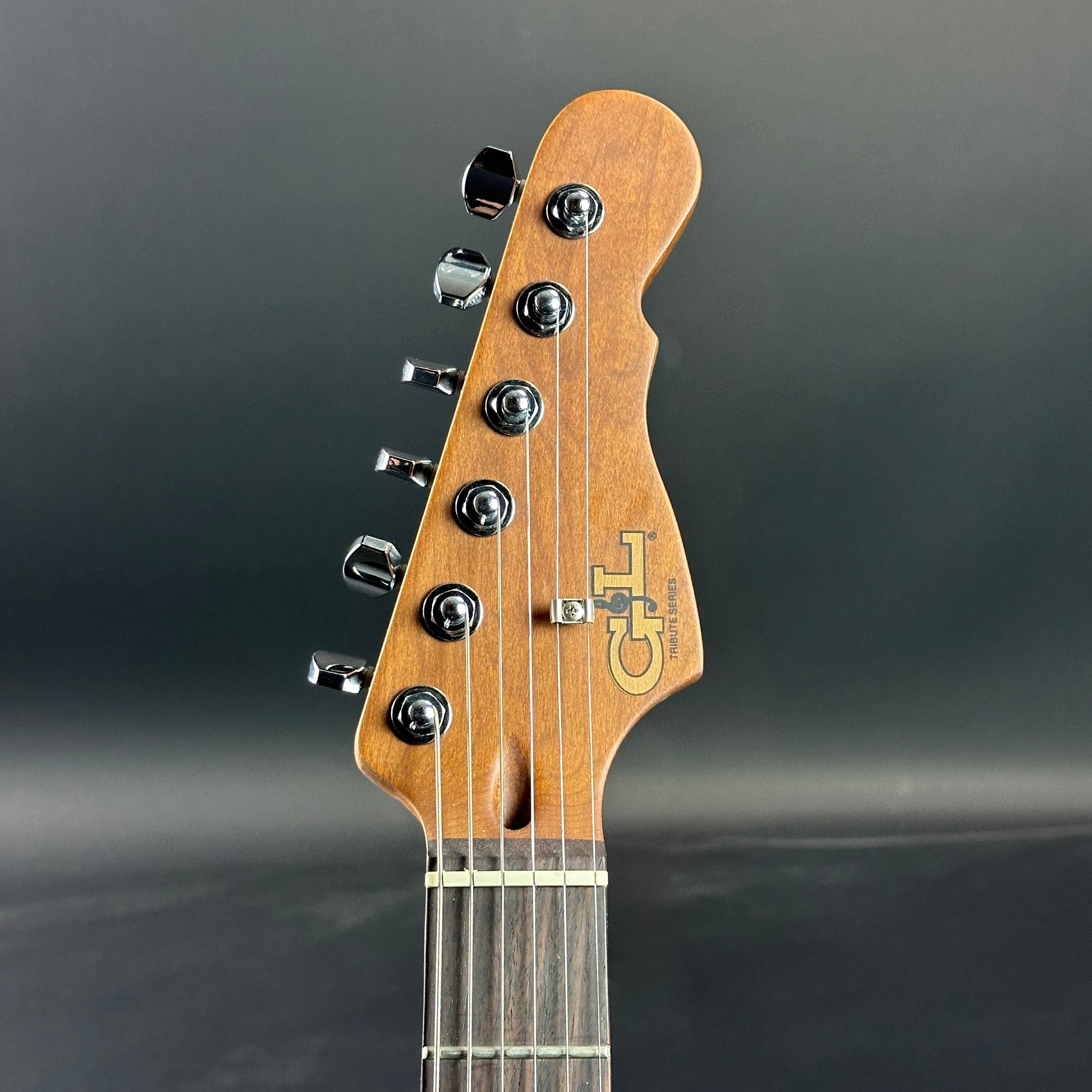 Front of headstock of Used G&L Comanche Tribue Sunburst.