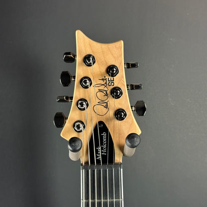 Front of headstock of Used PRS SE Mark Holcomb SVN Satin Walnut.