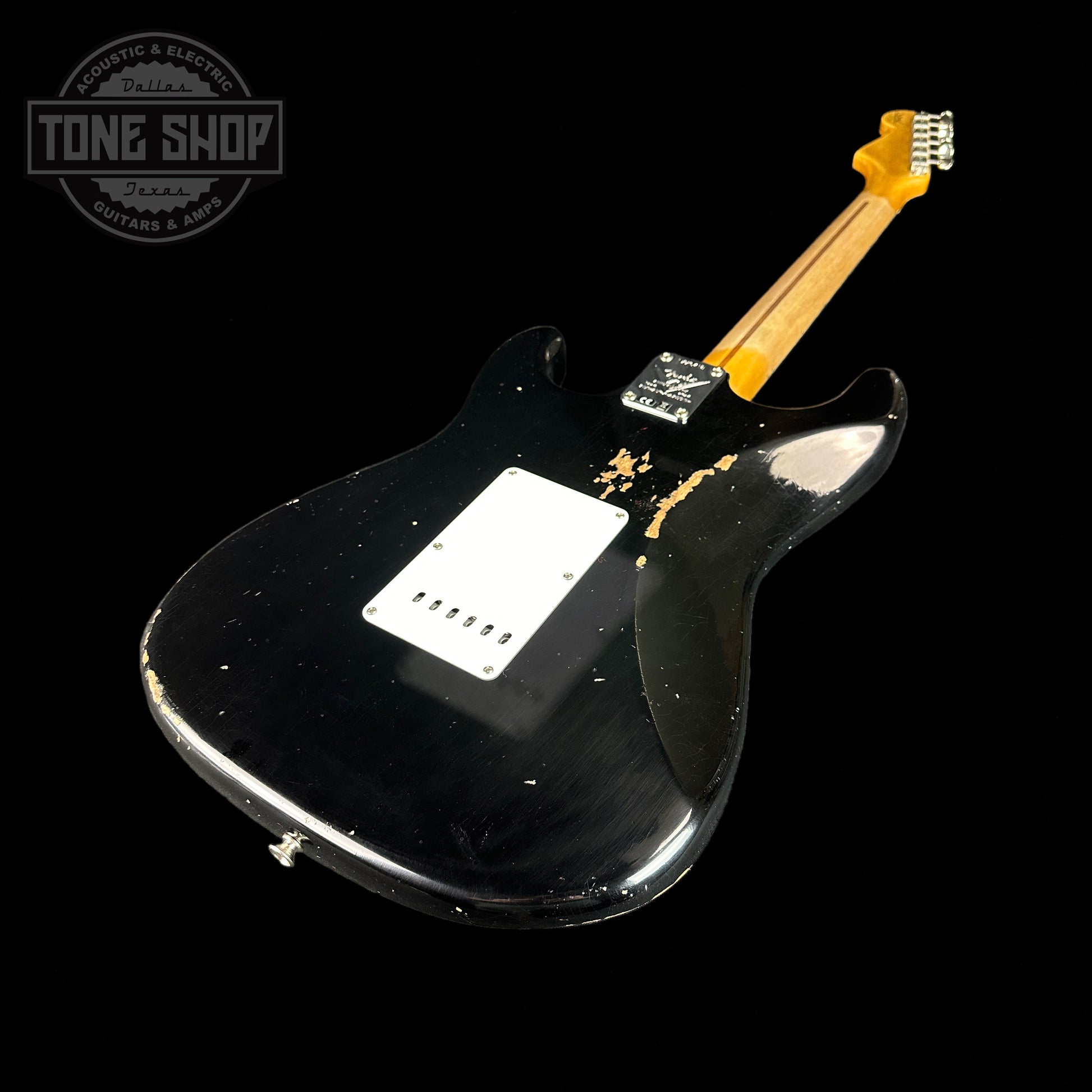 Back angle of Fender Custom Shop Limited Edition Fat '54 Strat Relic With Closet Classic Hardware Aged Black.