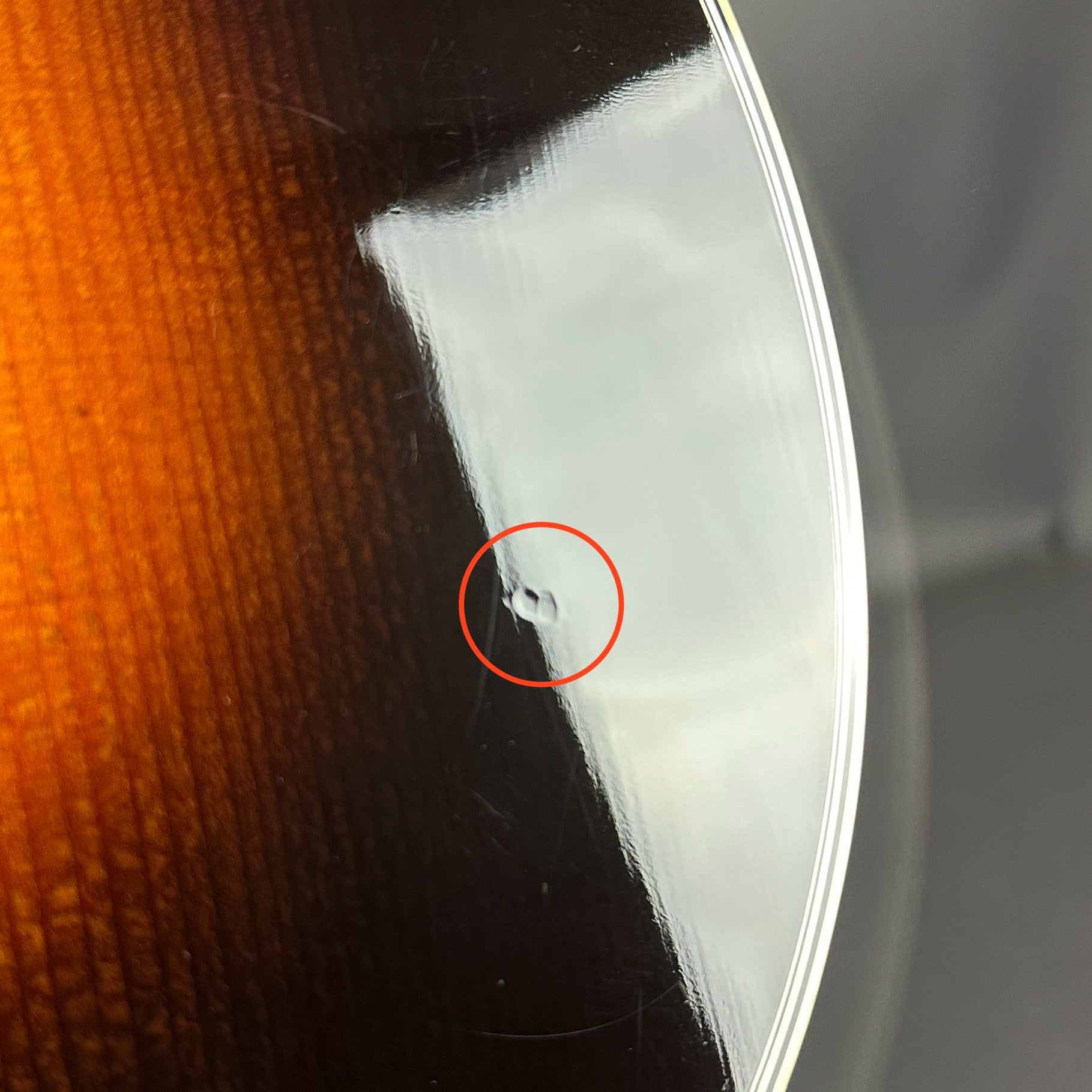 Small ding on body of Used Martin D-28 Sunburst.