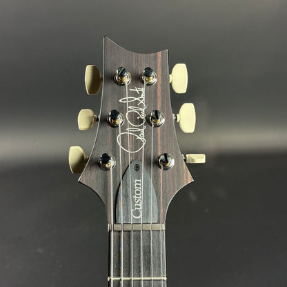 Front of headstock of PRS Custom 24-08 10 Top Fire Smokeburst.