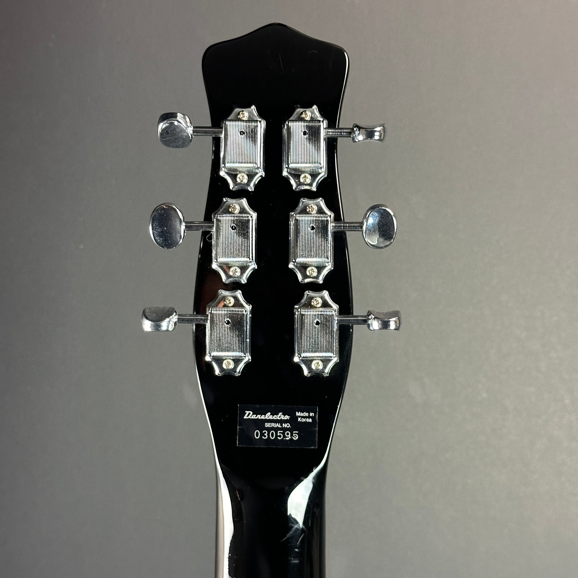 Back of headstock of Used Danelectro '59 DC NOS Black Metal Flake.