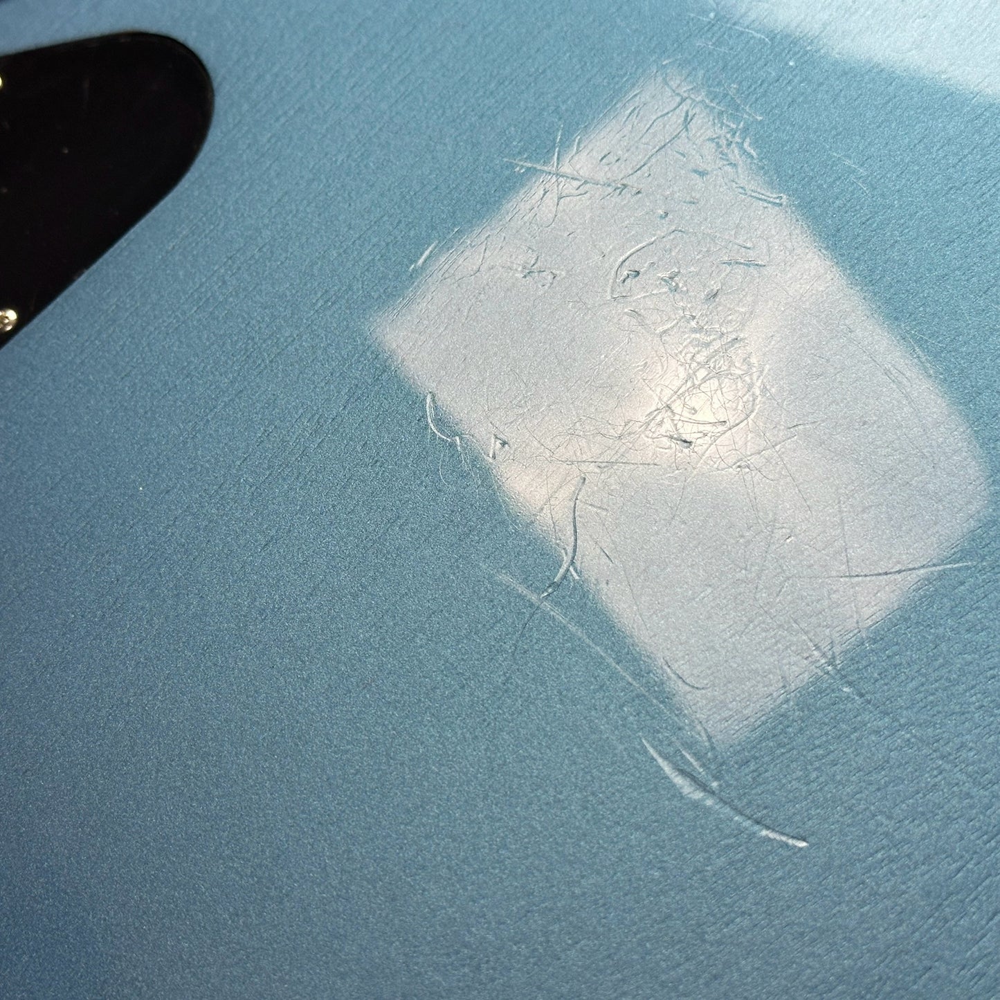 Scratches on back of Used Gibson Non-Reverse Firebird Pelham Blue.