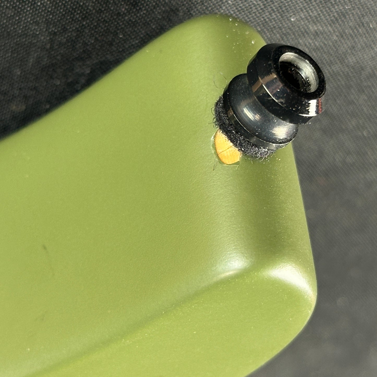 Chip near strap button of Used Suhr Modern Terra HSH Forest Green.