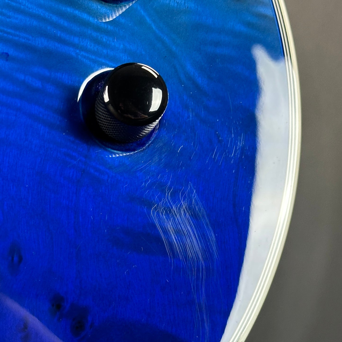 Scratches near controls of Used ESP LTD EC-1000 Deluxe Blue Nat Fade.