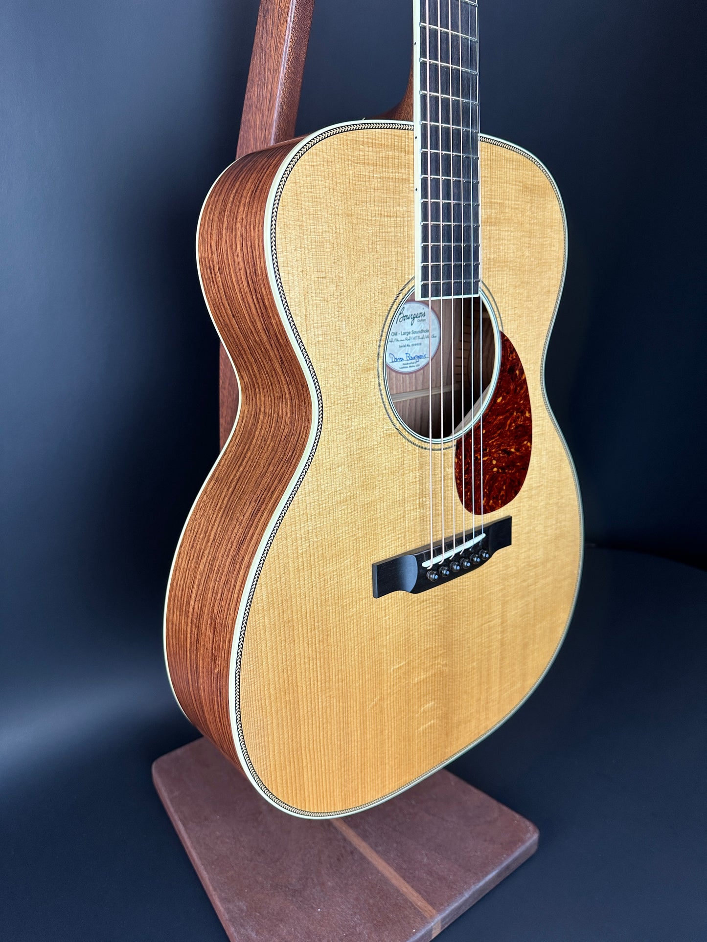 Front angle of Used Bourgeois Panama Red OM Large Soundhole Aged Adirondack.