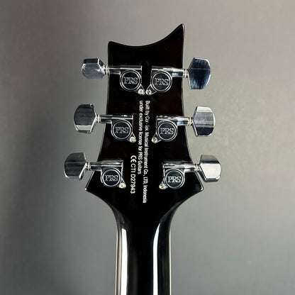 Back of headstock of Used PRS SE Custom 22 Semi-Hollow Black Gold Burst.