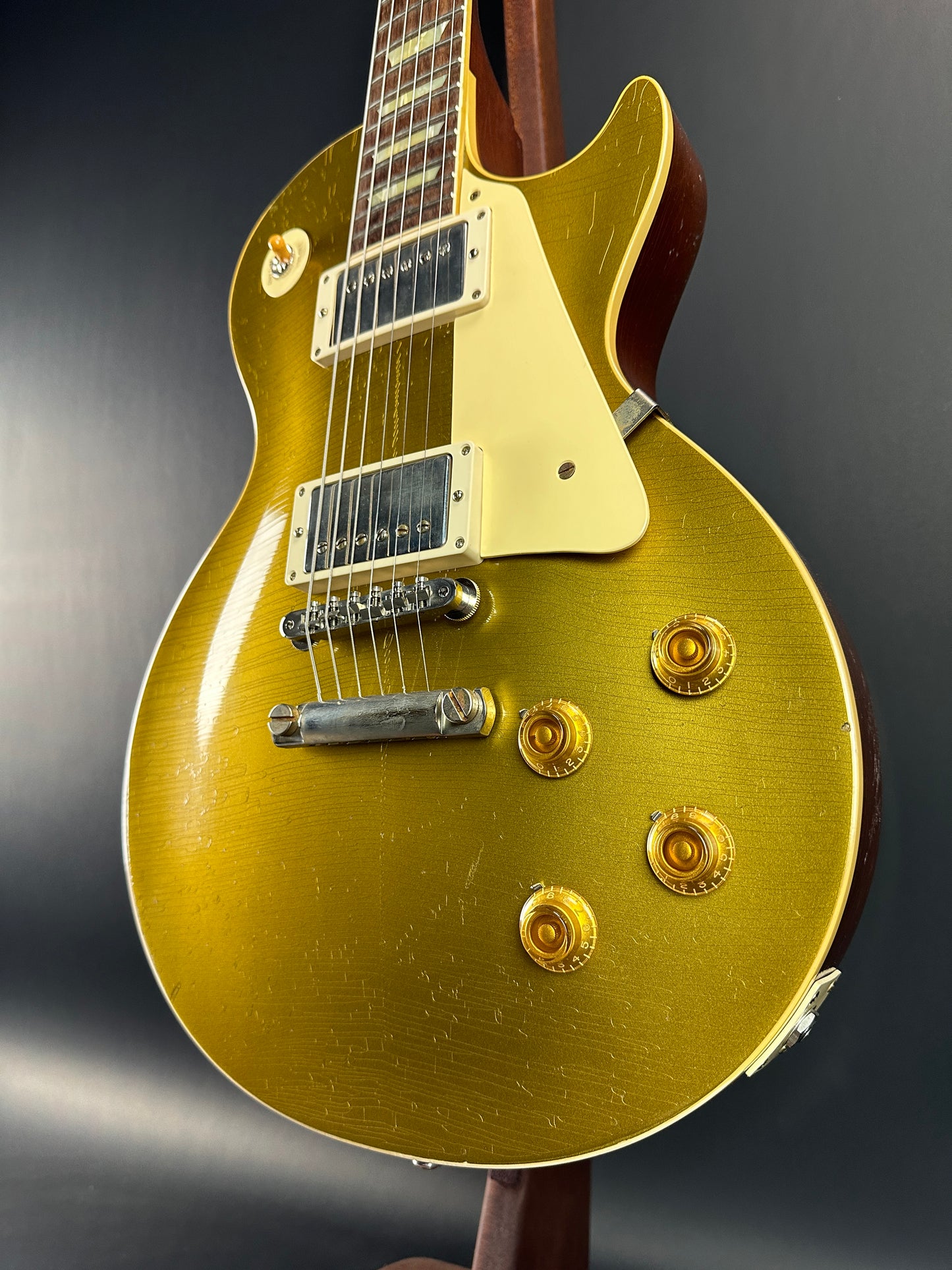 Front angle of Used Gibson Murphy Lab Light Aged Double Gold 1957 Les Paul Goldtop Dark Back.