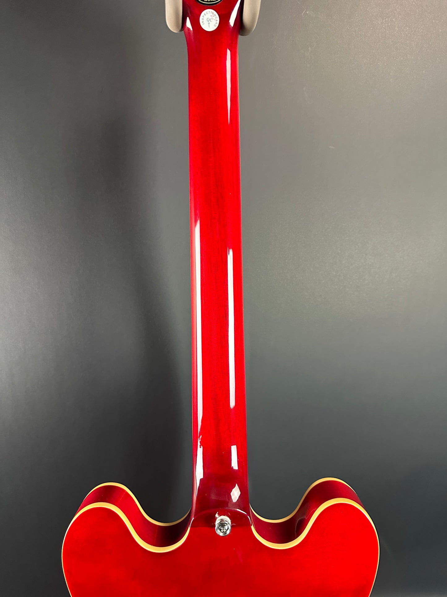 Back of neck of Used Epiphone 335 IG Cherry Red.