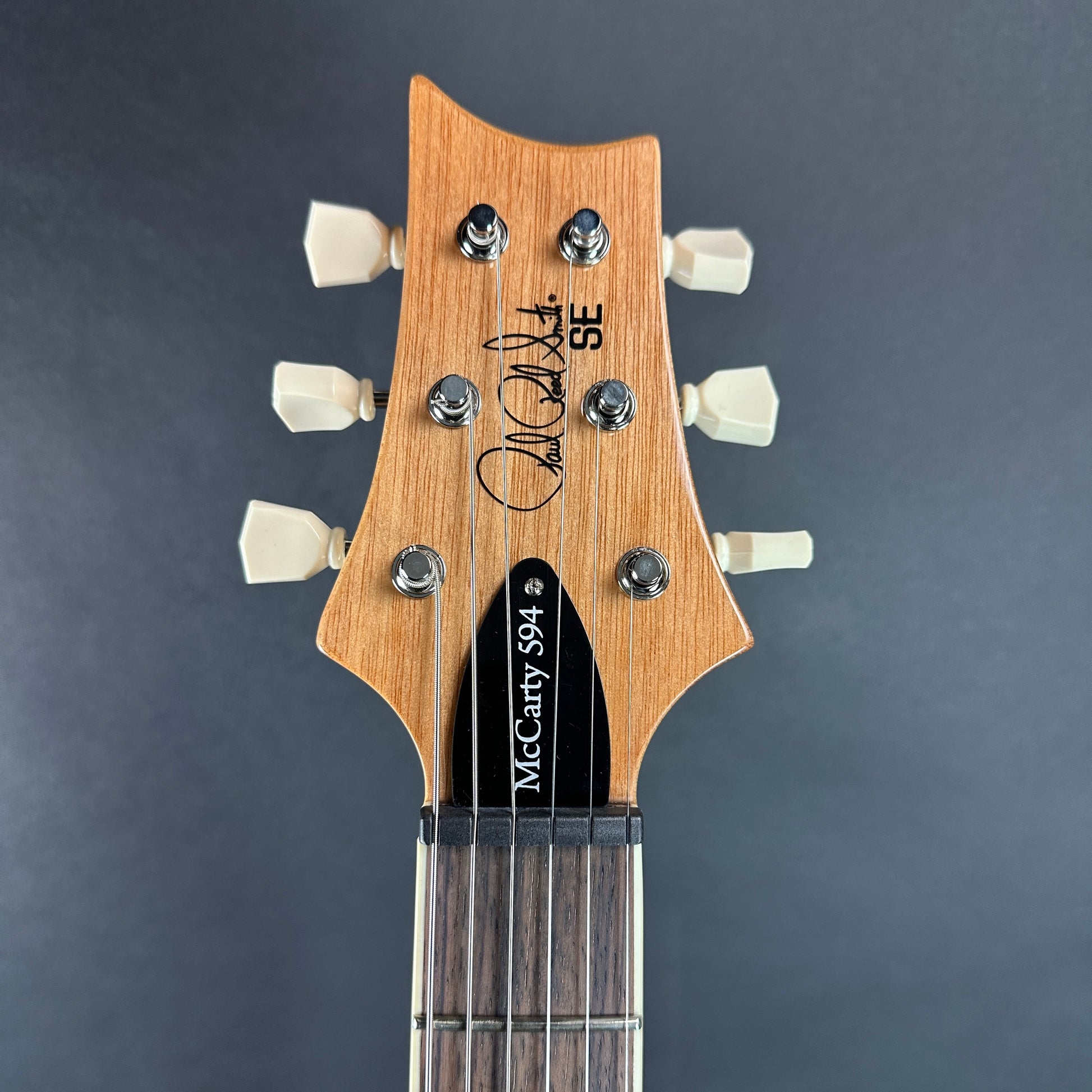 Front of headstock of Used PRS SE McCarty 594 Blue.