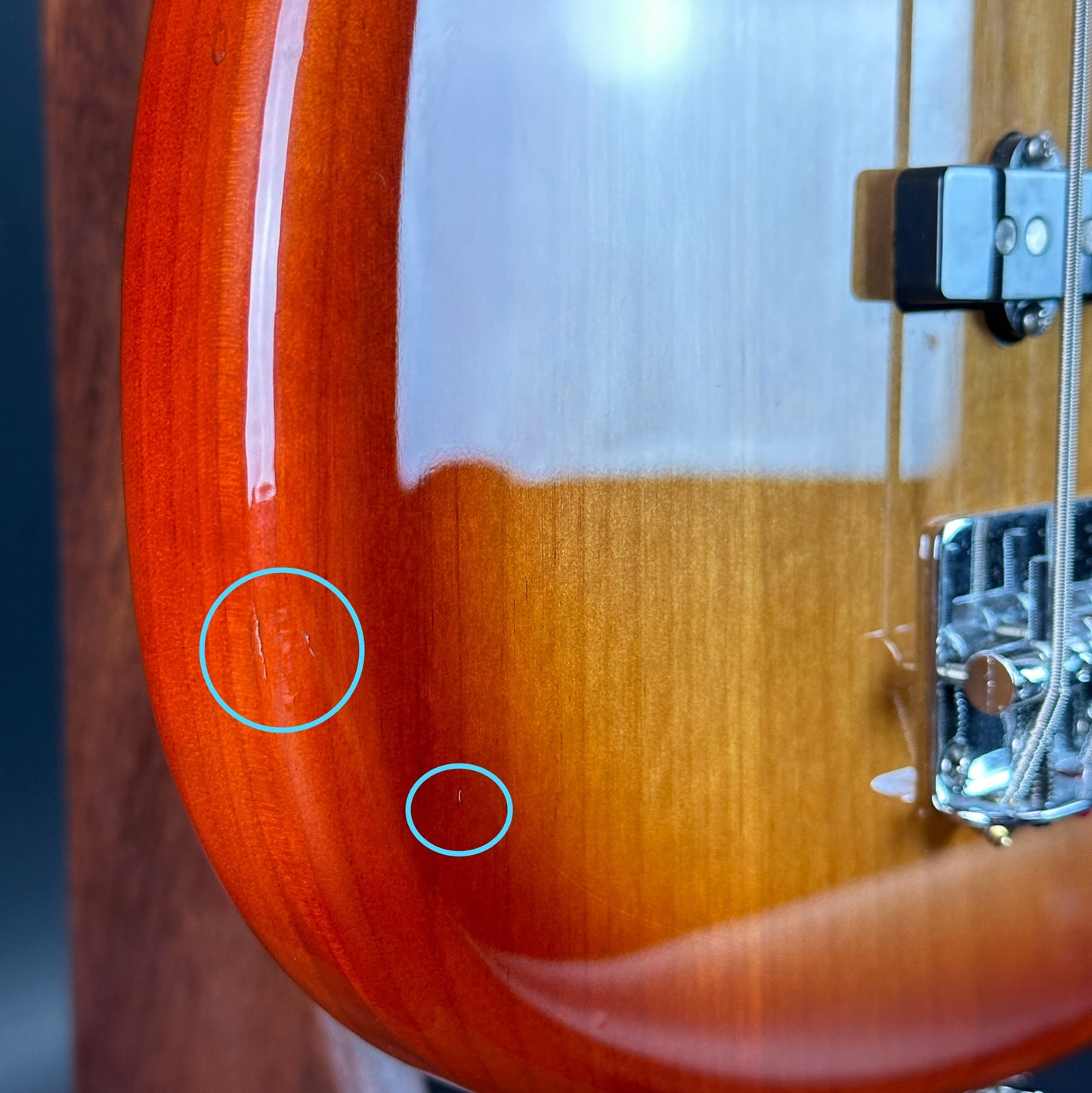 Dings on bottom edge of Used Fender Player Mustang Bass PJ Sienna Sunburst.