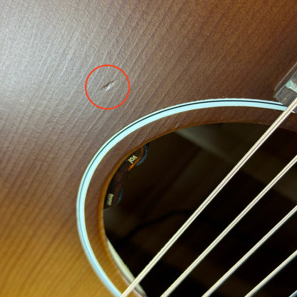 Small ding near soundhole of Used Gibson J-45 50's Faded Vintage Sunburst.