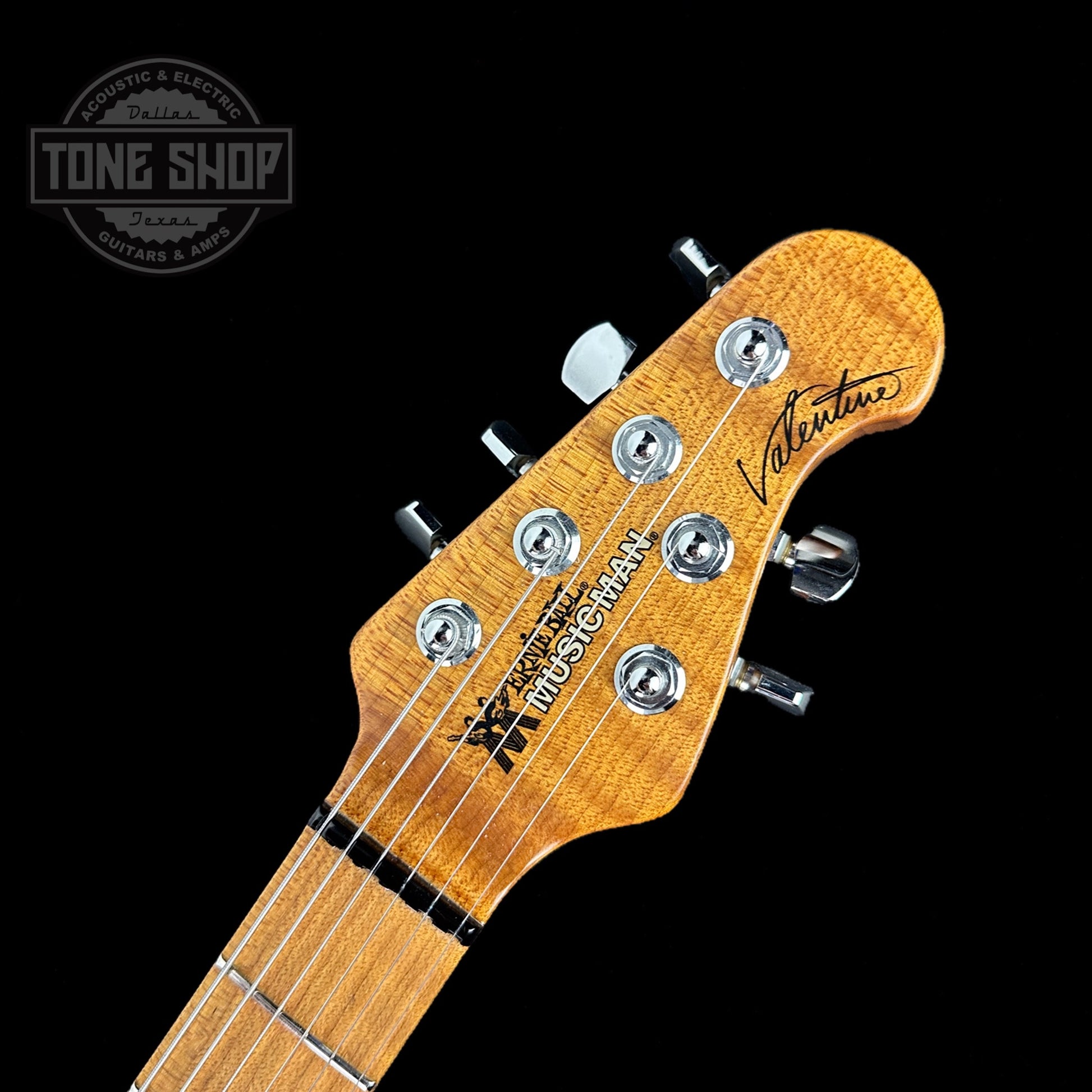 Front of headstock of Used Ernieball Musicman James Valentine Buttercream.