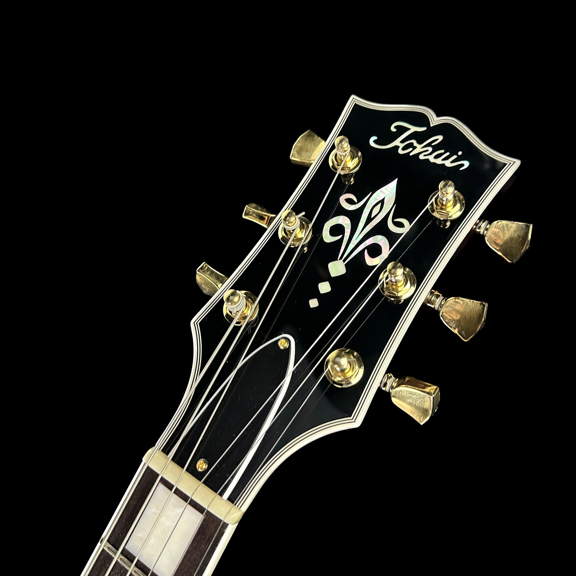 Front of headstock of Used Tokai LC156 Wine Red.