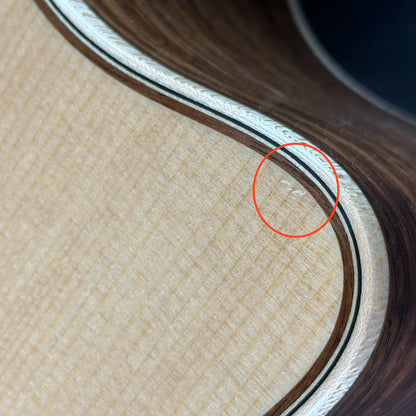Small ding near cutaway of Used Taylor 856ce 12 String.