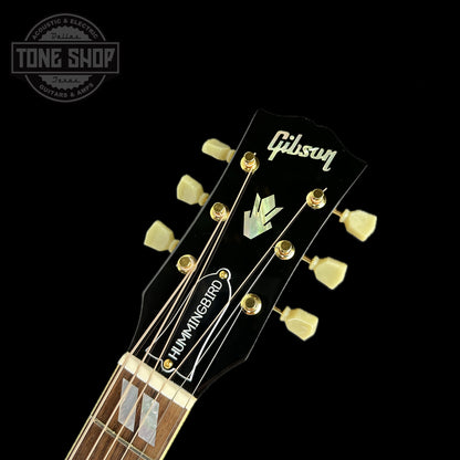 Front of headstock of Used Gibson Custom Shop M2M Hummingbird Original Adi Red Spruce Top.