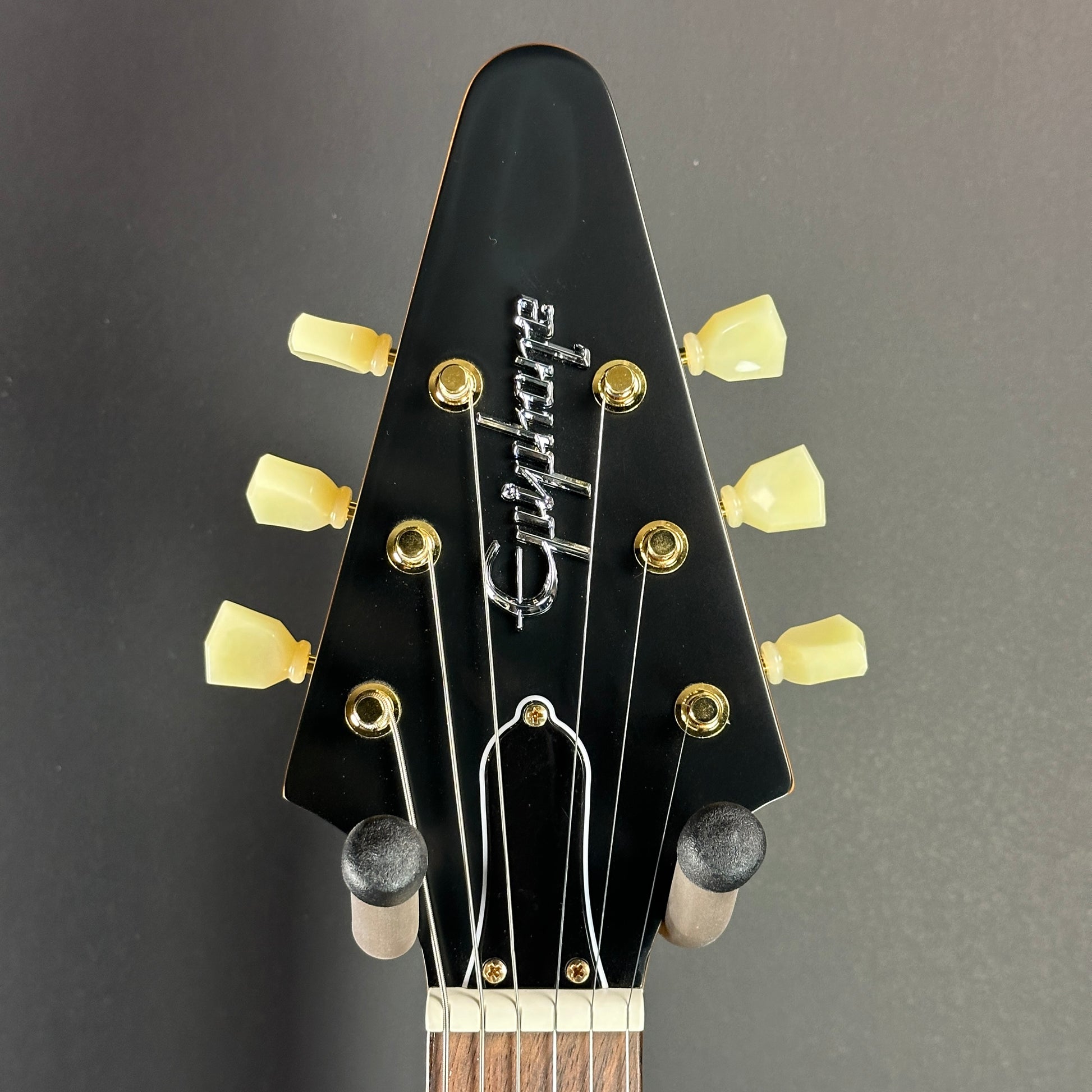 Front of headstock of Used Epiphone 1958 Korina Flying V.